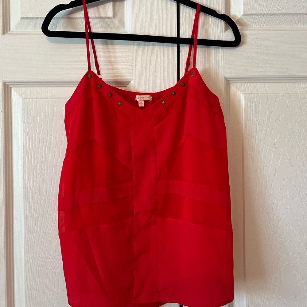 Women red blouse gold detail